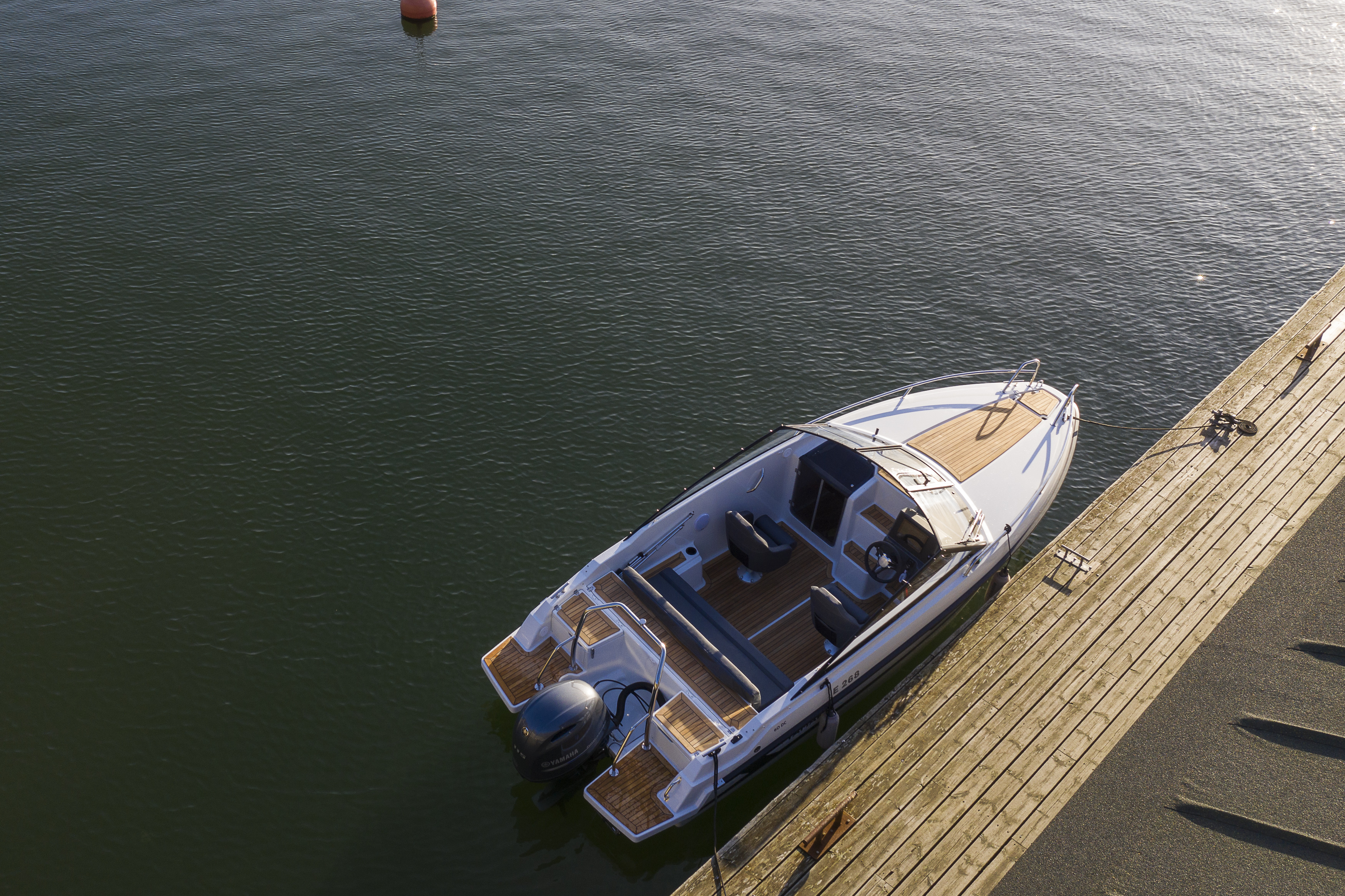 Yamarin 60 day cruiser by a pier