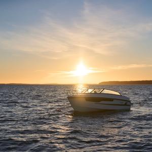 Yamarin 67 DC driving on the sea. Sundown in the background.