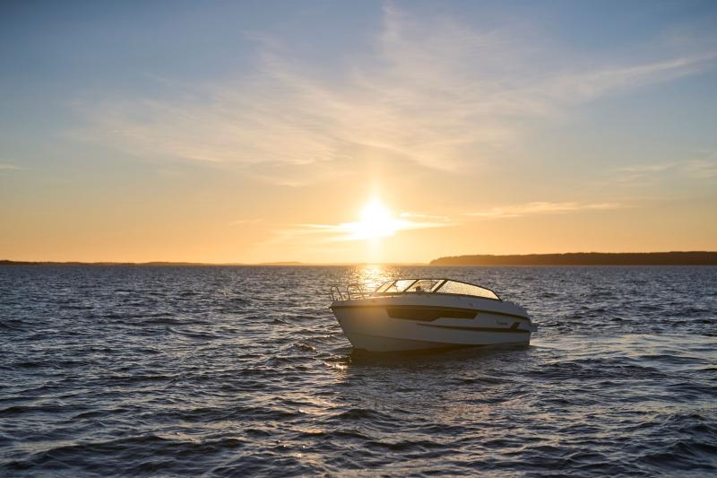 Yamarin 67 DC driving on the sea. Sundown in the background.
